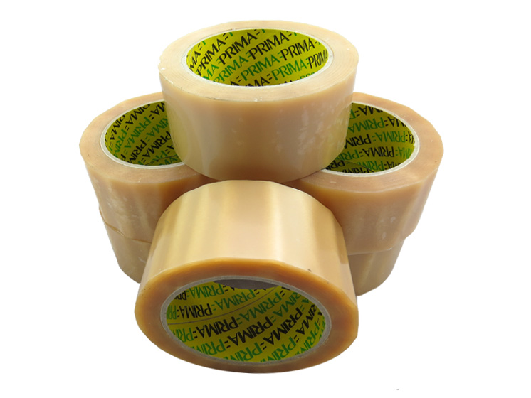 Stack of clear vinyl packing tape rolls on a white background.