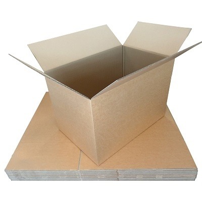 An assembled double-wall box placed atop a stack of folded boxes