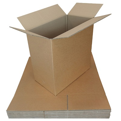 Open double-wall cardboard box standing on a stack of flat-packed cartons, showing the sturdy BC-flute construction used to ship electronics.