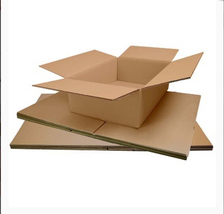 Open brown cardboard Royal Mail small parcel box sitting on a stack of flat-packed single and double-walled boxes.