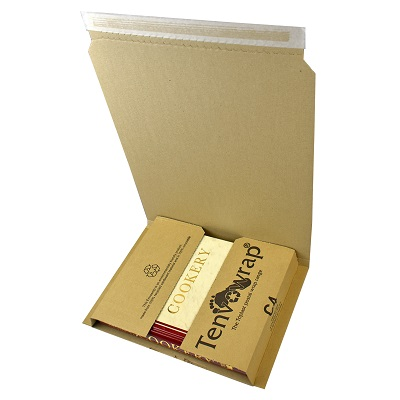 Open Kraft C4 book wrap with a slim book and flat product fitted snugly inside, showing the adjustable depth secures items without void fill.