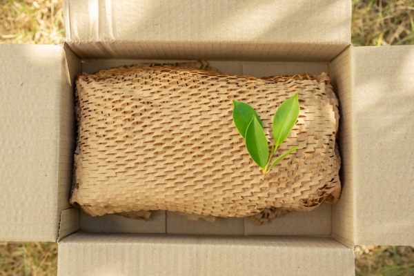 green leaf on eco-friendly brown pater honeycomb wrap for product packaging parcel
