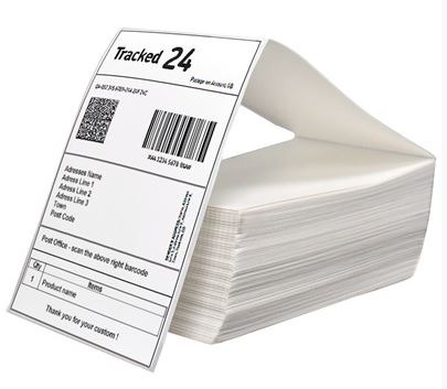Stack of white fanfold thermal labels.