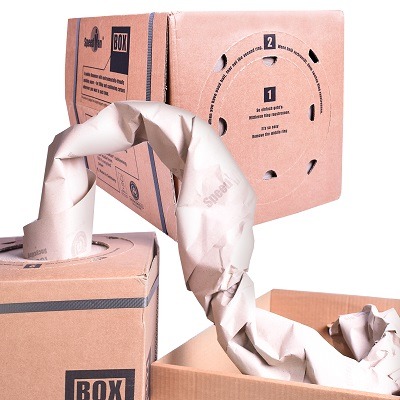 Speedman BOX paper void fill dispenser feeding crumpled kraft paper into a carton.